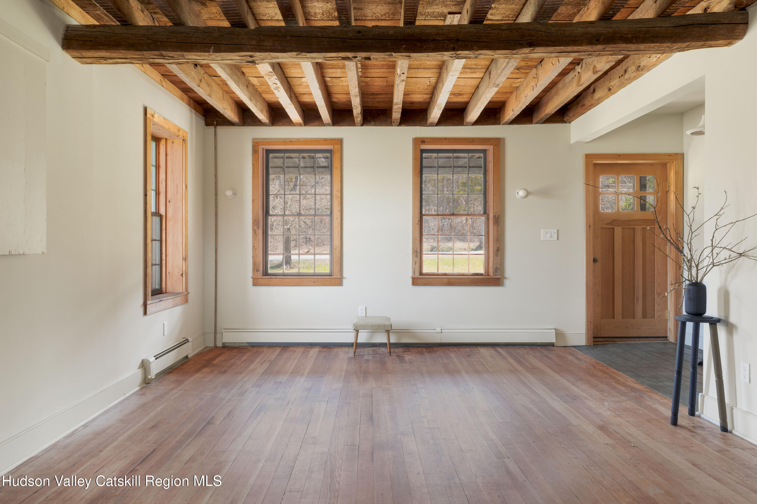 857 Flats Road Athens, NY 12015 - Photo 10 of 30 an empty room with wooden floor and windows