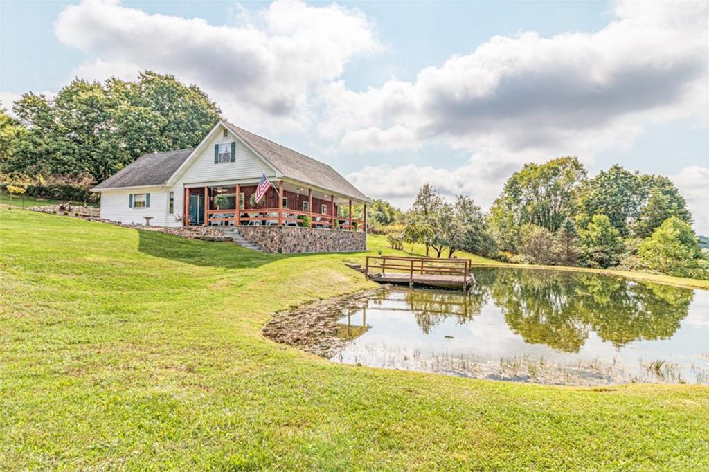 3209 Bela Road Parker, PA 16049 - Photo 1 of 50 a view of a house with a yard and lake view