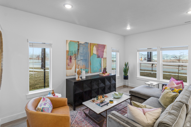 3003 South 265th Street West, Unit 751 Logan, UT 84321 - Photo 5 of 29 Living area featuring plenty of natural light, wood finished floors, and recessed lighting