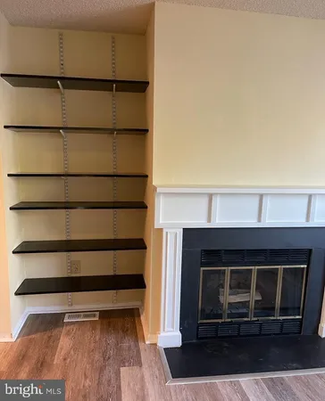 a view of a room with a fireplace
