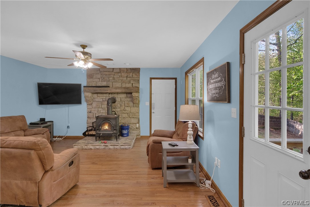 16116 Tyler Station Road Beaverdam, VA 23015 - Photo 17 of 50 a living room with furniture a flat screen tv and a fireplace