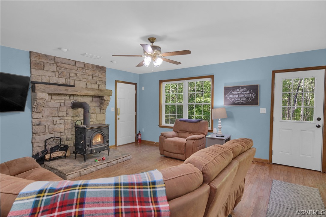 16116 Tyler Station Road Beaverdam, VA 23015 - Photo 20 of 50 a living room with furniture a flat screen tv and a fireplace