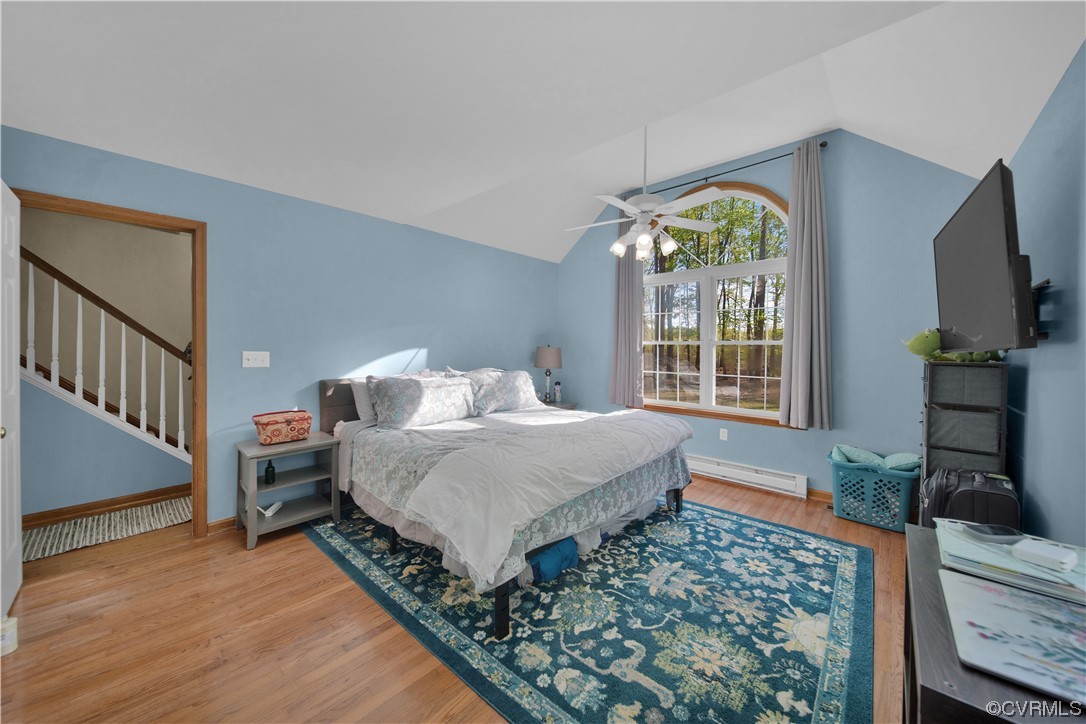 16116 Tyler Station Road Beaverdam, VA 23015 - Photo 24 of 50 a spacious bedroom with a bed a dresser and windows