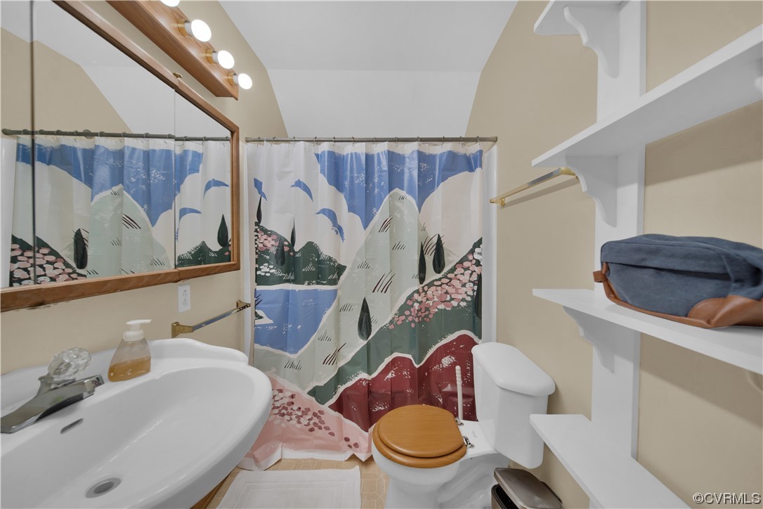 16116 Tyler Station Road Beaverdam, VA 23015 - Photo 29 of 50 a bathroom with a toilet a sink and a mirror