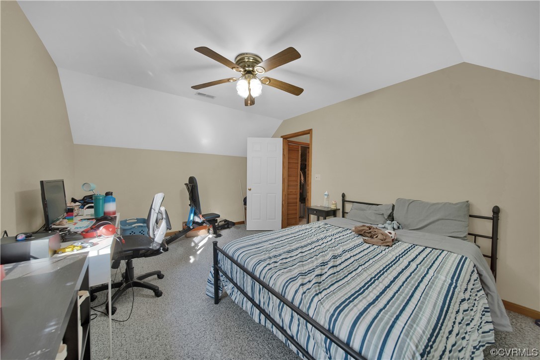 16116 Tyler Station Road Beaverdam, VA 23015 - Photo 32 of 50 a bedroom that has a bed and a chandelier