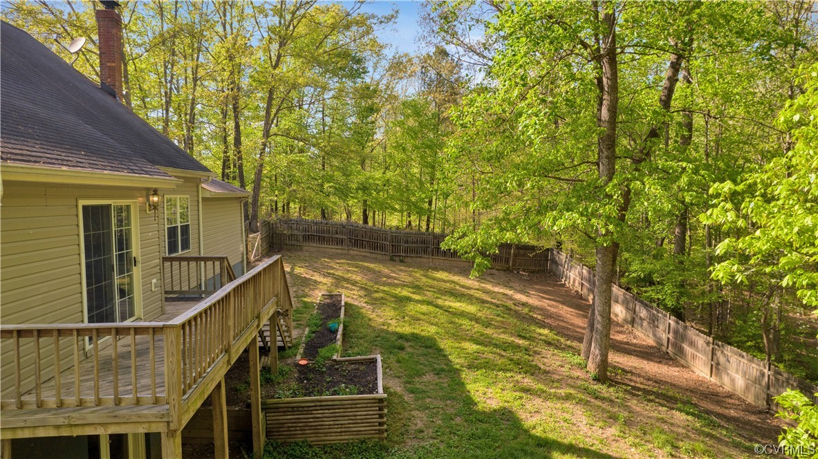 16116 Tyler Station Road Beaverdam, VA 23015 - Photo 34 of 50 a view of balcony with two plants and wooden fence