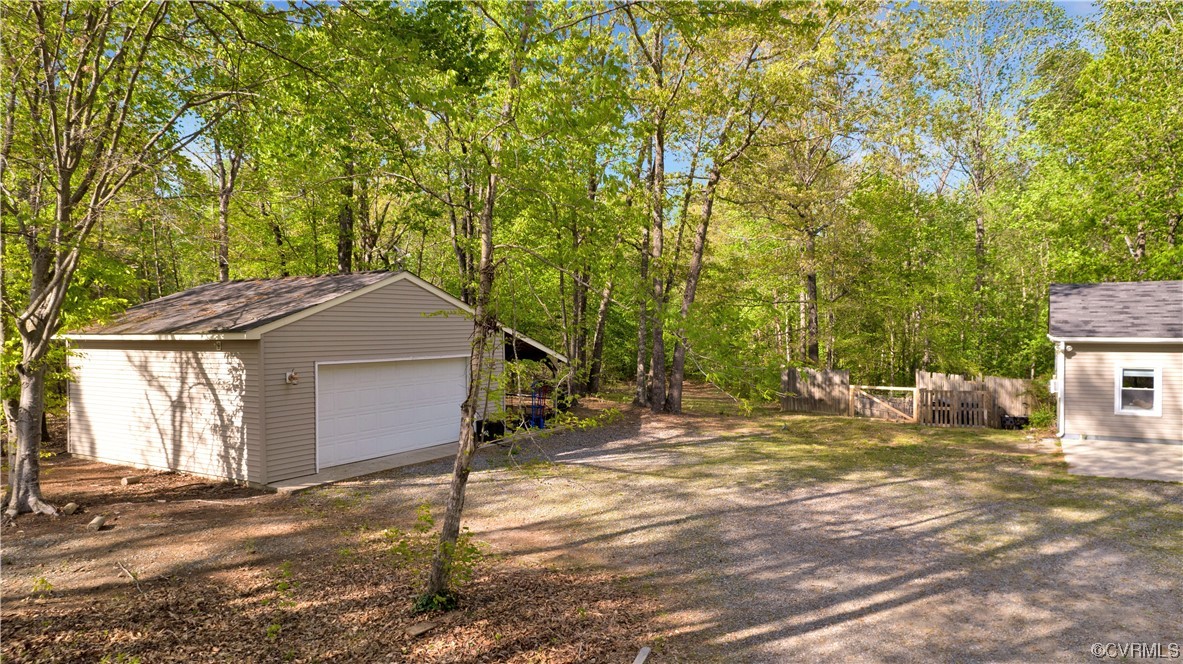 16116 Tyler Station Road Beaverdam, VA 23015 - Photo 42 of 50 a yellow house with trees in front of it