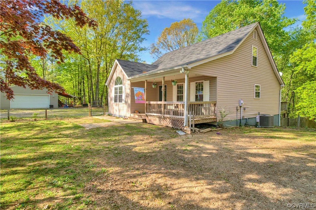 16116 Tyler Station Road Beaverdam, VA 23015 - Photo 6 of 50 a view of a house with a yard and potted plants
