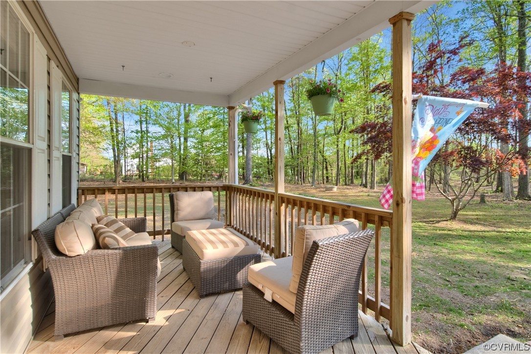 16116 Tyler Station Road Beaverdam, VA 23015 - Photo 7 of 50 a balcony with wooden floor and outdoor seating