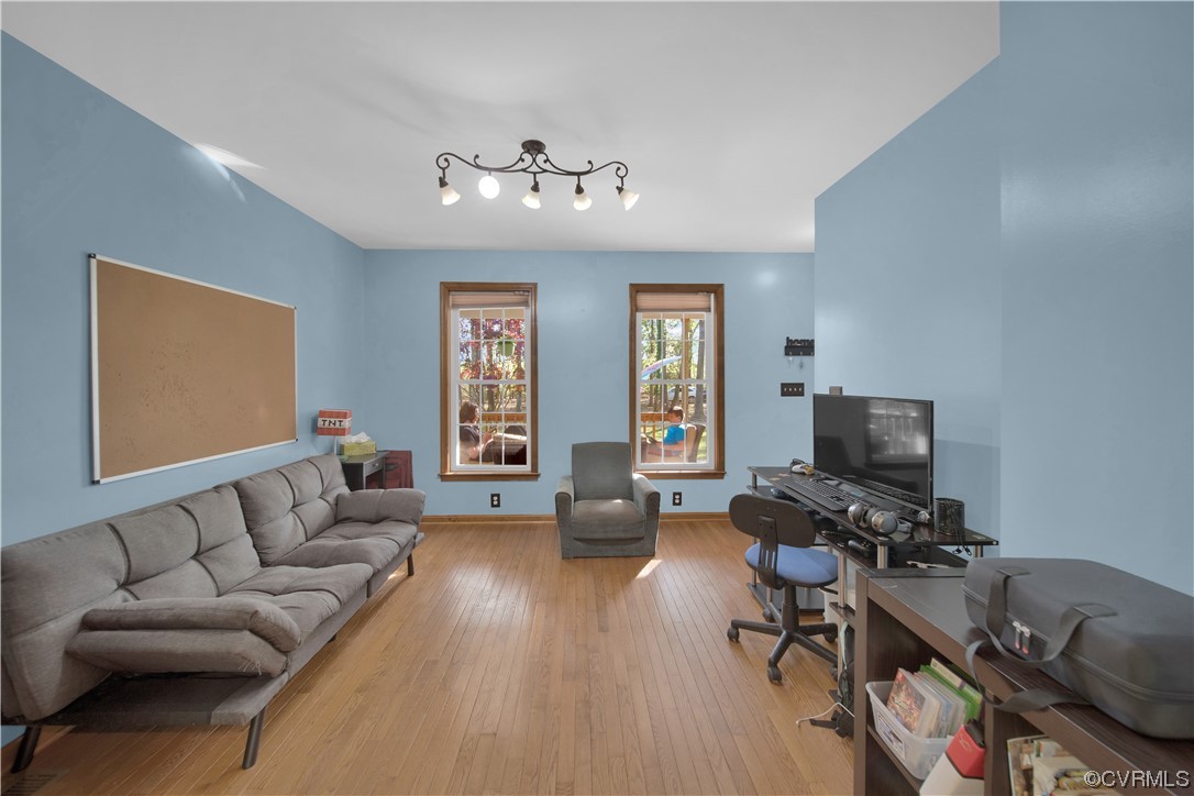 16116 Tyler Station Road Beaverdam, VA 23015 - Photo 10 of 50 a living room with furniture flat screen tv and a window