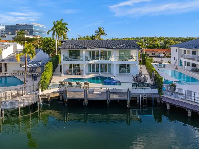 a view of a patio with swimming pool table and chairs