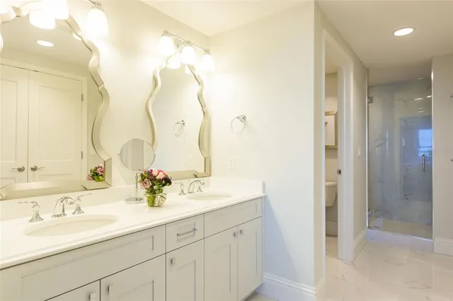 a bathroom with a double vanity sink and a mirror