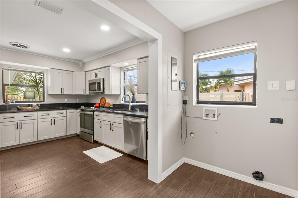 660 Java Road Cocoa Beach, FL 32931 - Photo 12 of 31 a kitchen with a refrigerator and a stove top oven