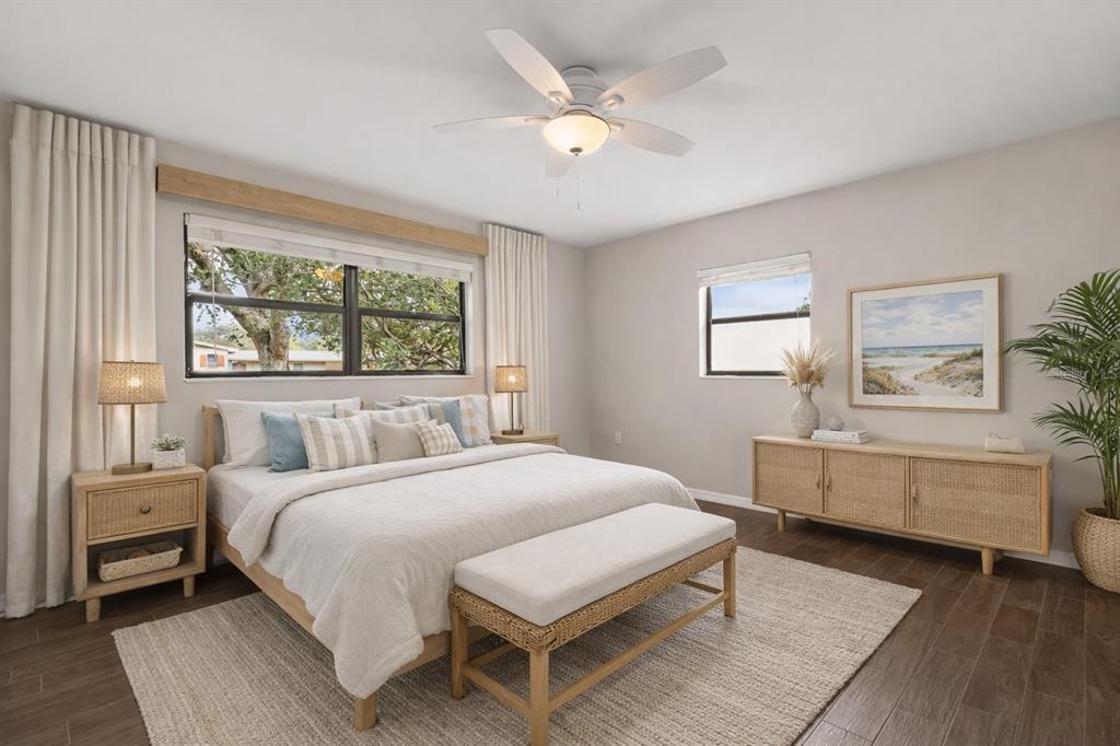 660 Java Road Cocoa Beach, FL 32931 - Photo 17 of 31 a bedroom with a large bed and windows