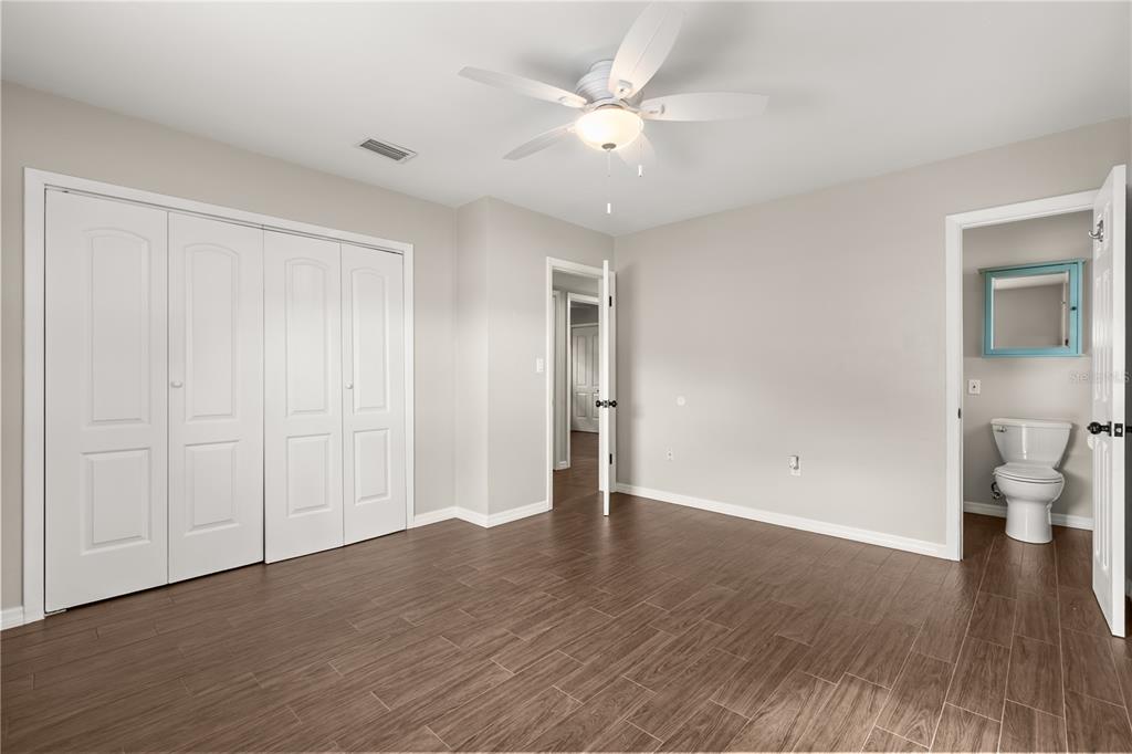 660 Java Road Cocoa Beach, FL 32931 - Photo 22 of 31 a view of an empty room with wooden floor