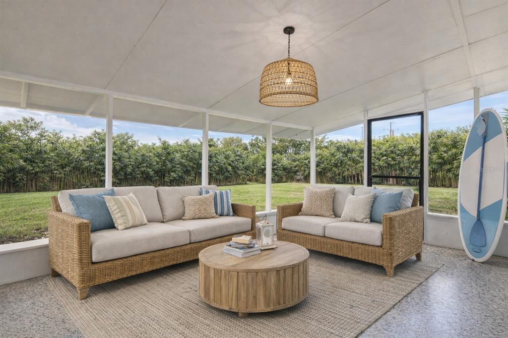 660 Java Road Cocoa Beach, FL 32931 - Photo 26 of 31 a living room with furniture and a large window