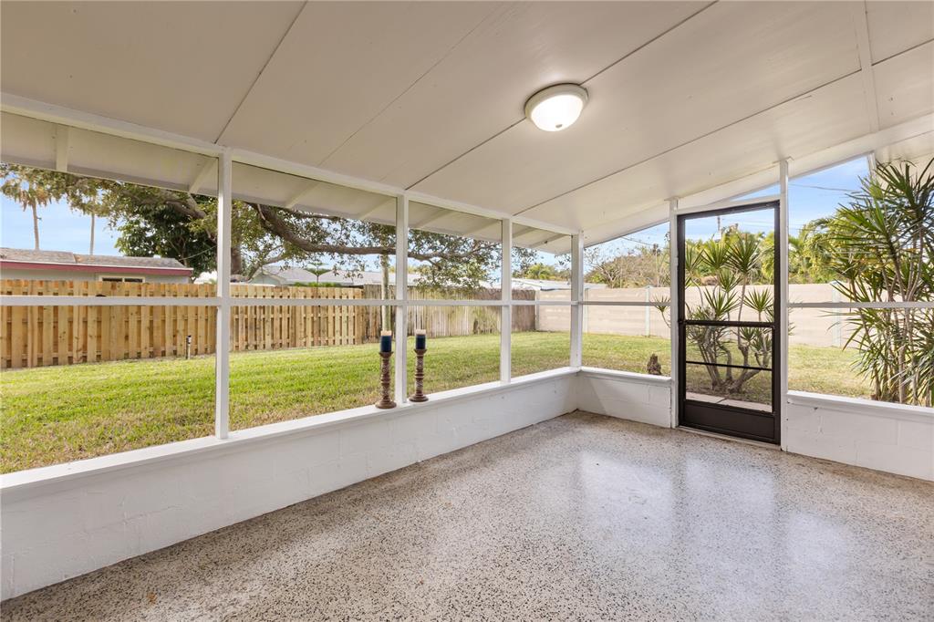 660 Java Road Cocoa Beach, FL 32931 - Photo 27 of 31 a view of an empty room with a sliding door
