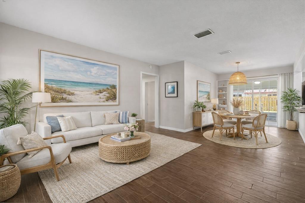 660 Java Road Cocoa Beach, FL 32931 - Photo 3 of 31 a living room with furniture and a wooden floor