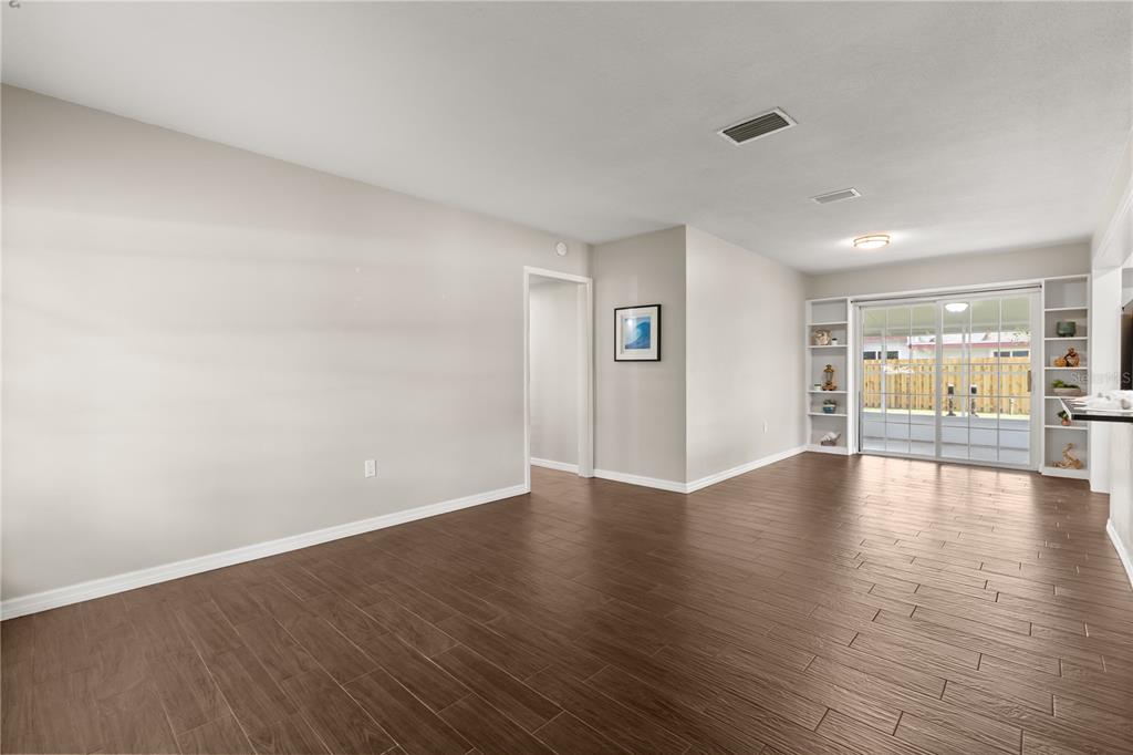 660 Java Road Cocoa Beach, FL 32931 - Photo 4 of 31 a view of an empty room with wooden floor