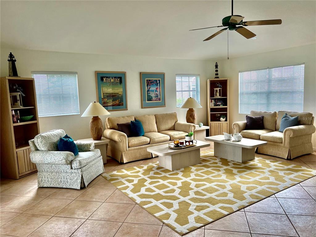 4005 Big Pass Lane Punta Gorda, FL 33955 - Photo 12 of 42 a living room with furniture and floor to ceiling window