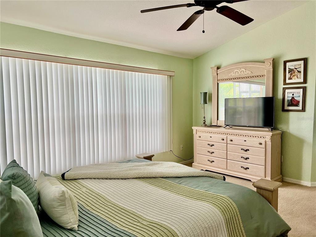 4005 Big Pass Lane Punta Gorda, FL 33955 - Photo 18 of 42 a bedroom with a bed and a dresser