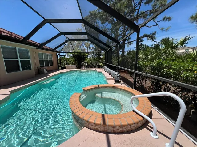 a view of a swimming pool with a patio