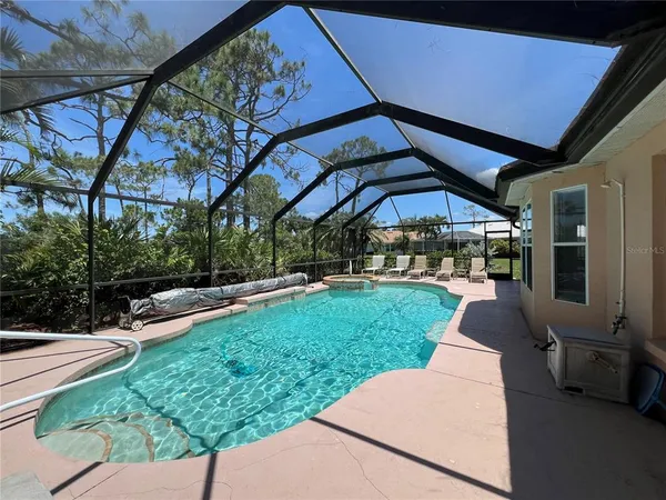 a view of a backyard with sitting area