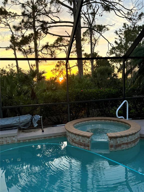4005 Big Pass Lane Punta Gorda, FL 33955 - Photo 8 of 42 a view of a swimming pool with a patio