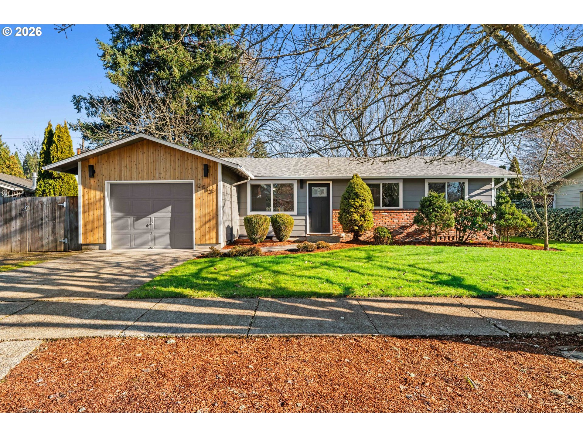 2583 Stratford Street Eugene, OR 97404 - Photo 1 of 31 a front view of a house with a yard table and chairs