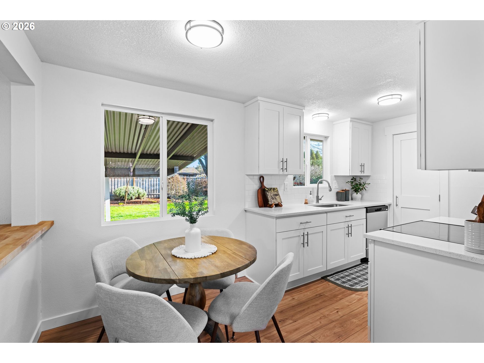 2583 Stratford Street Eugene, OR 97404 - Photo 11 of 31 a kitchen with a sink cabinets and a table