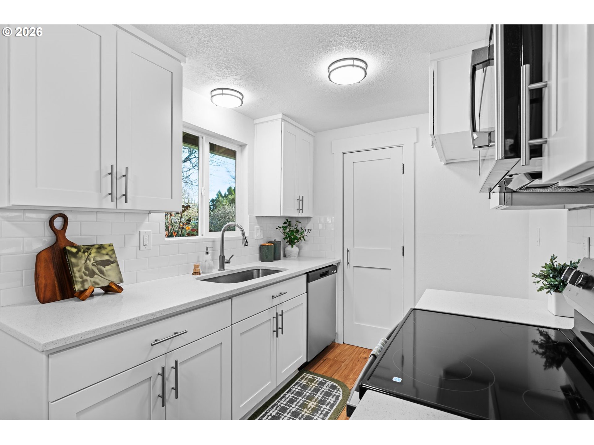 2583 Stratford Street Eugene, OR 97404 - Photo 12 of 31 a kitchen with a sink and cabinets