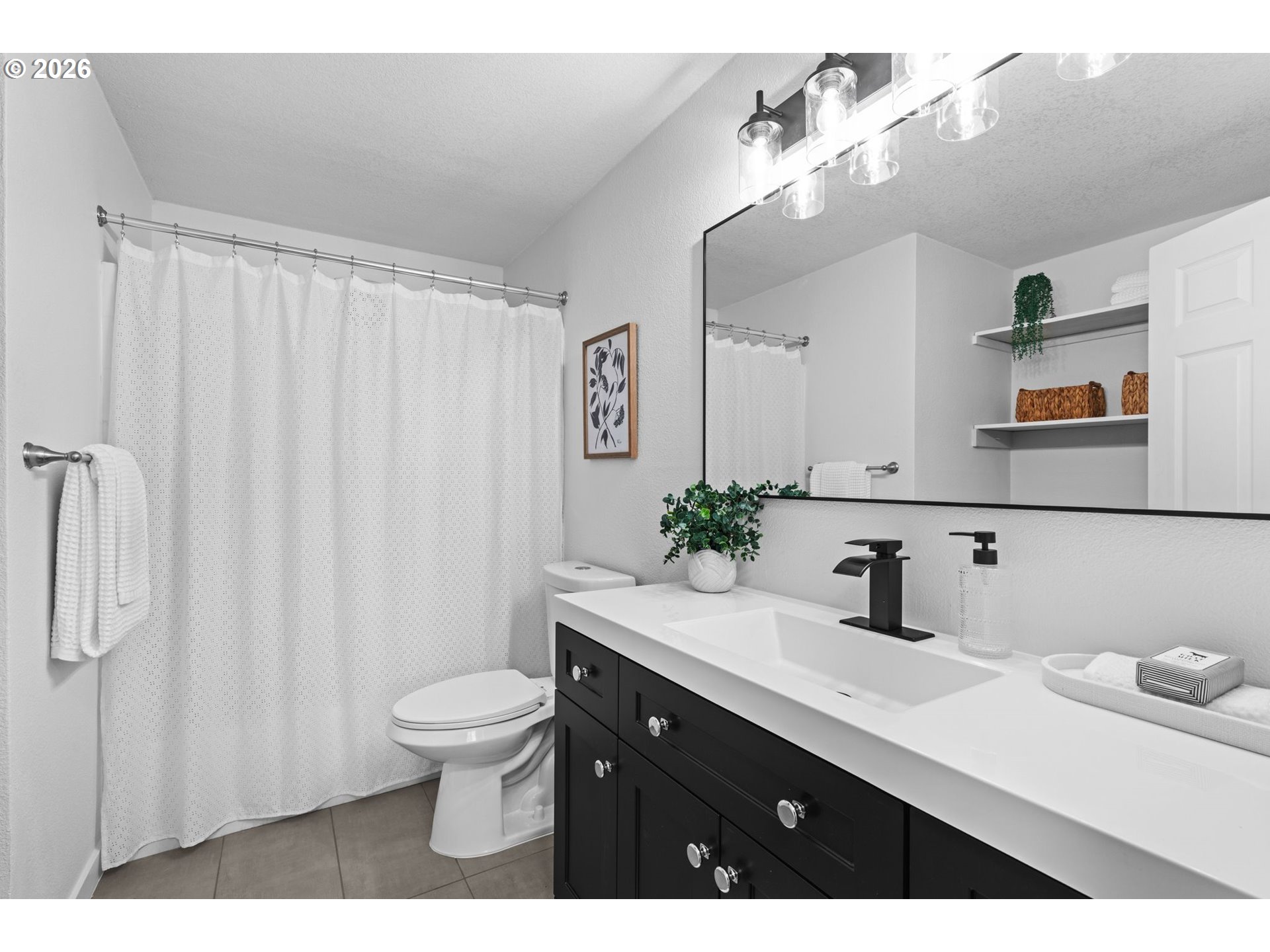 2583 Stratford Street Eugene, OR 97404 - Photo 23 of 31 a bathroom with a sink a toilet and mirror