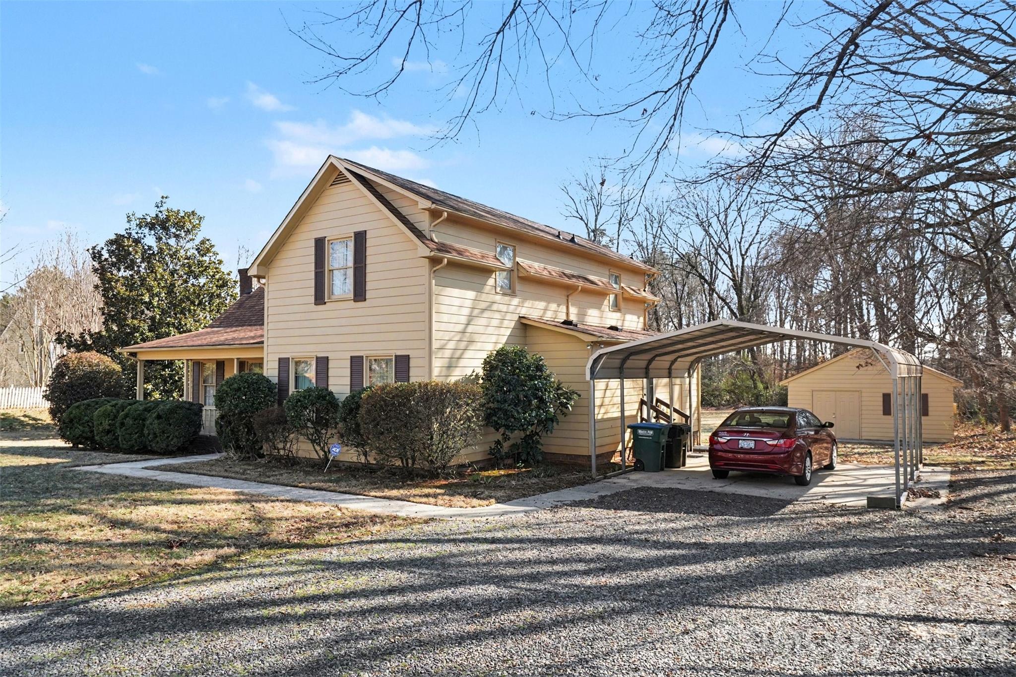 2116 Rice Road Matthews, NC 28105 - Photo 3 of 15 a front view of a house with a yard