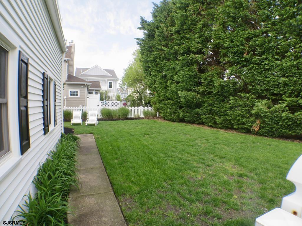 814 Wesley Road Ocean City, NJ 08226 - Photo 4 of 29 a view of a garden with pathway