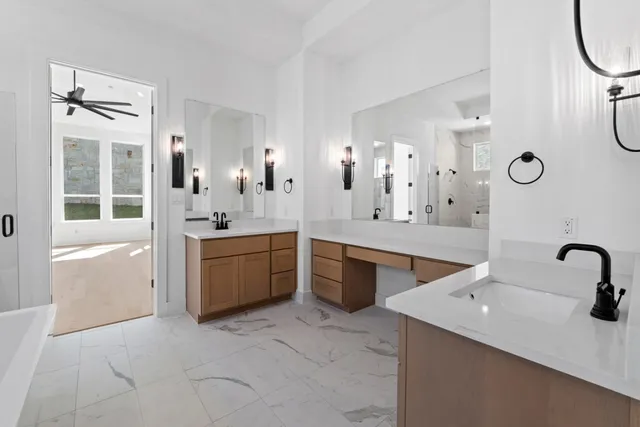 a large bathroom with a double vanity sink a mirror and shower