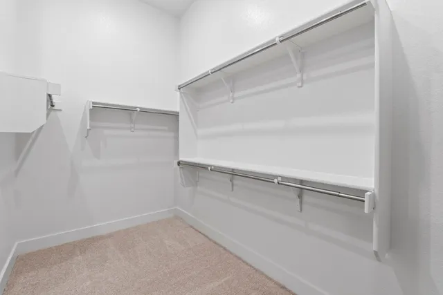 a view of an empty walk in closet