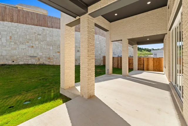 a view of a house with a small yard