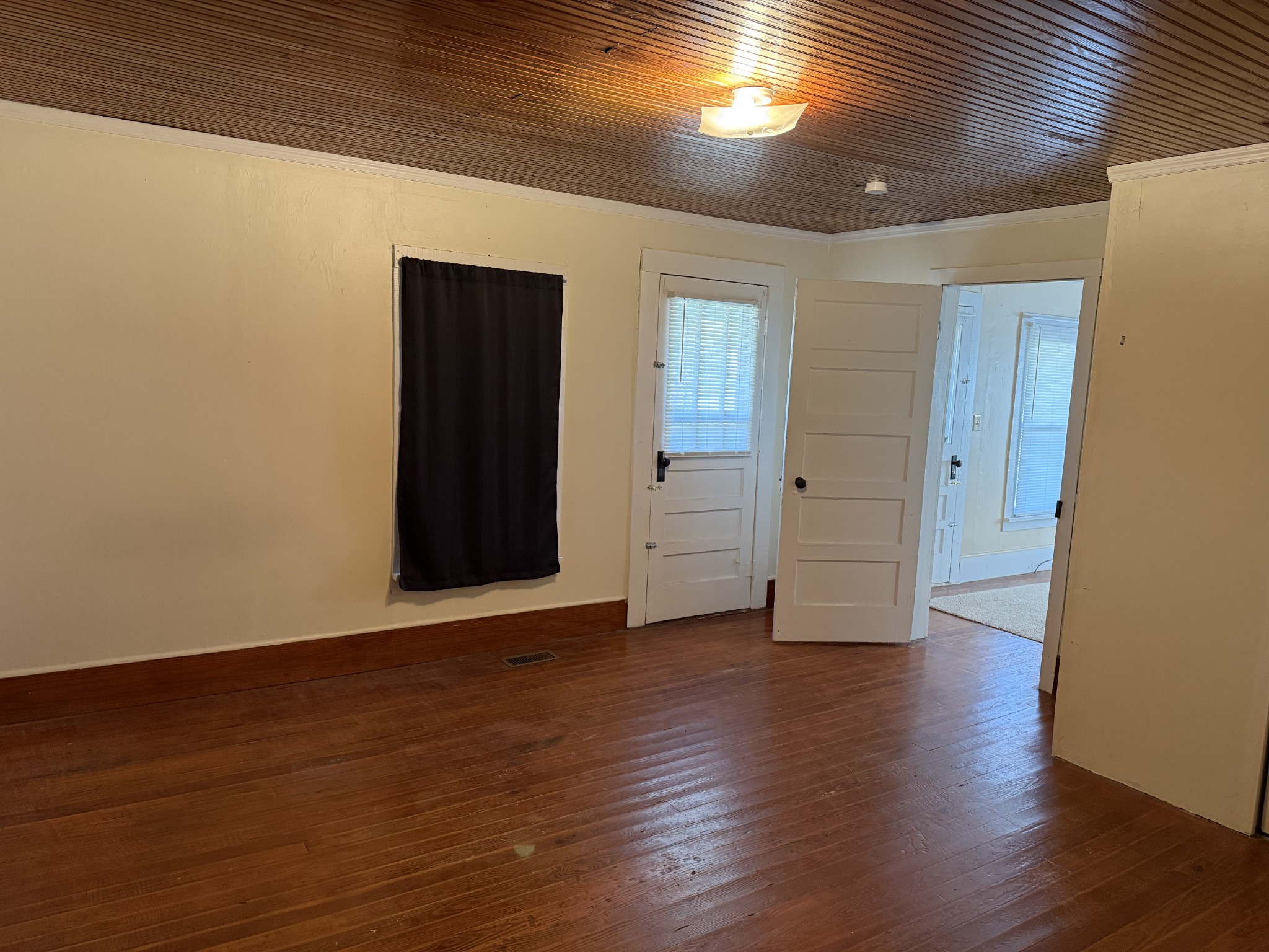 21625 Seminary Street Hollow Rock, TN 38342 - Photo 11 of 17 a view of an empty room with wooden floor
