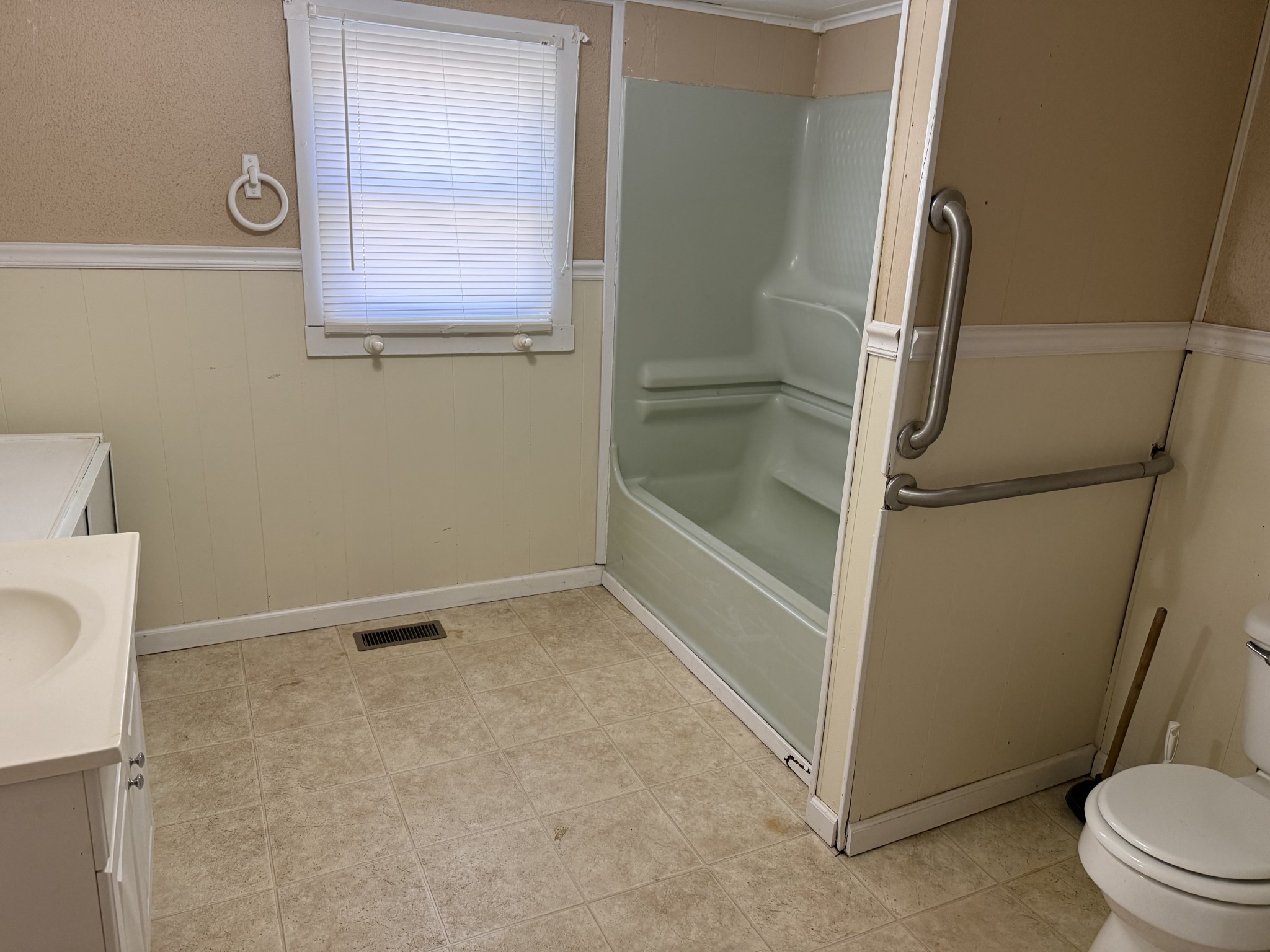 21625 Seminary Street Hollow Rock, TN 38342 - Photo 14 of 17 a bathroom with a granite countertop shower and a toilet