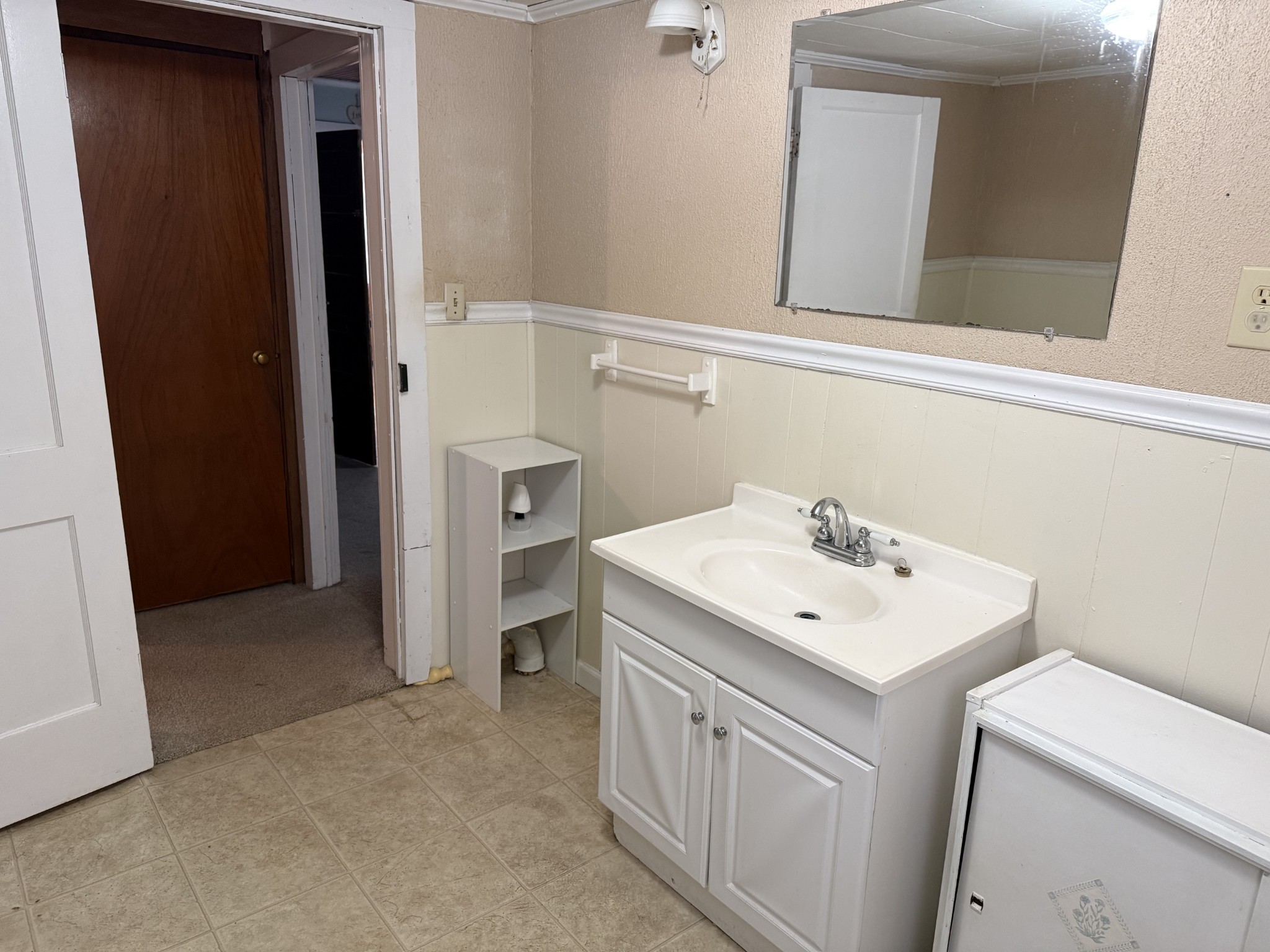 21625 Seminary Street Hollow Rock, TN 38342 - Photo 15 of 17 a view of a sink and a mirror
