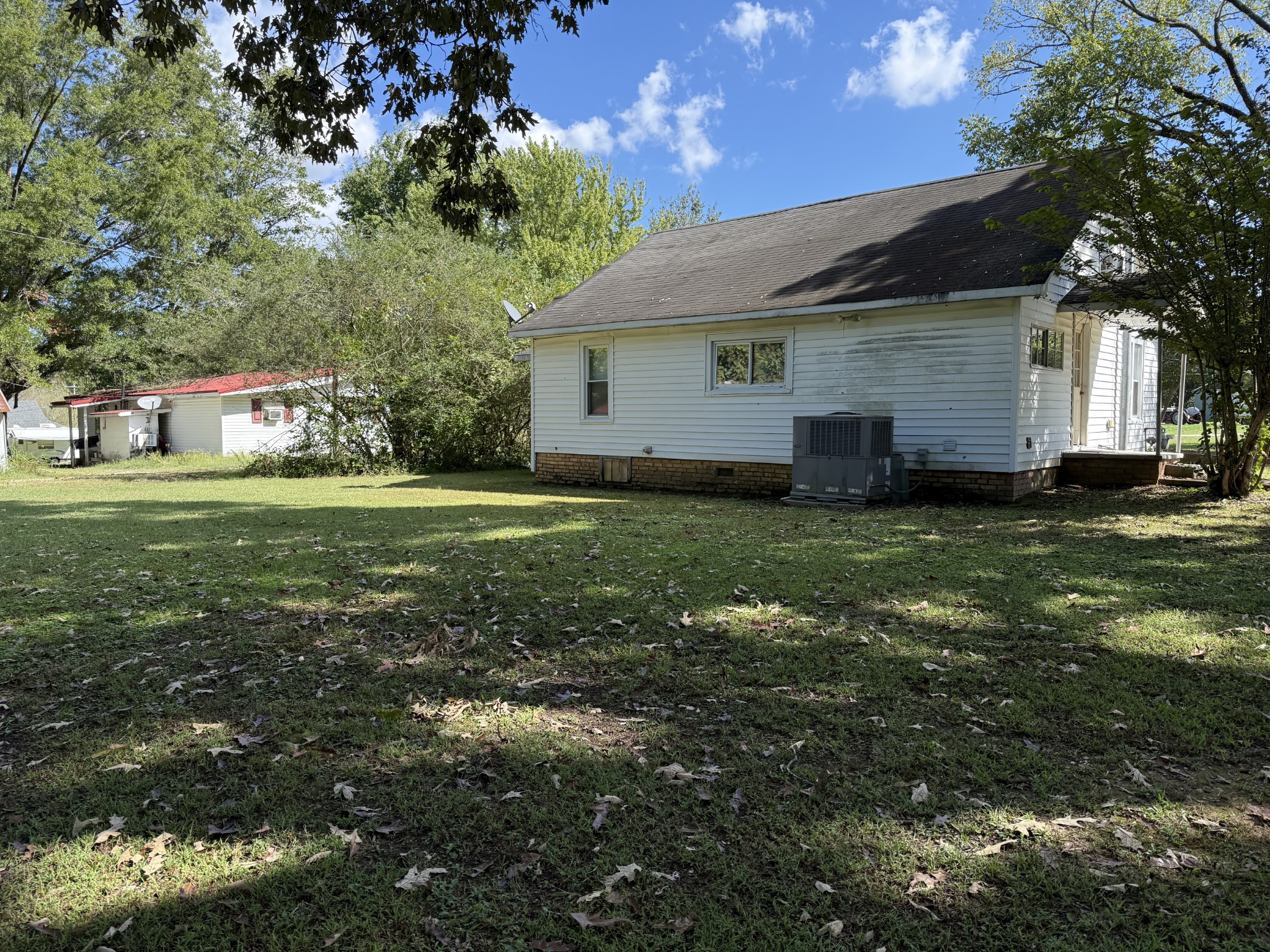 21625 Seminary Street Hollow Rock, TN 38342 - Photo 2 of 17 a view of a house with a yard