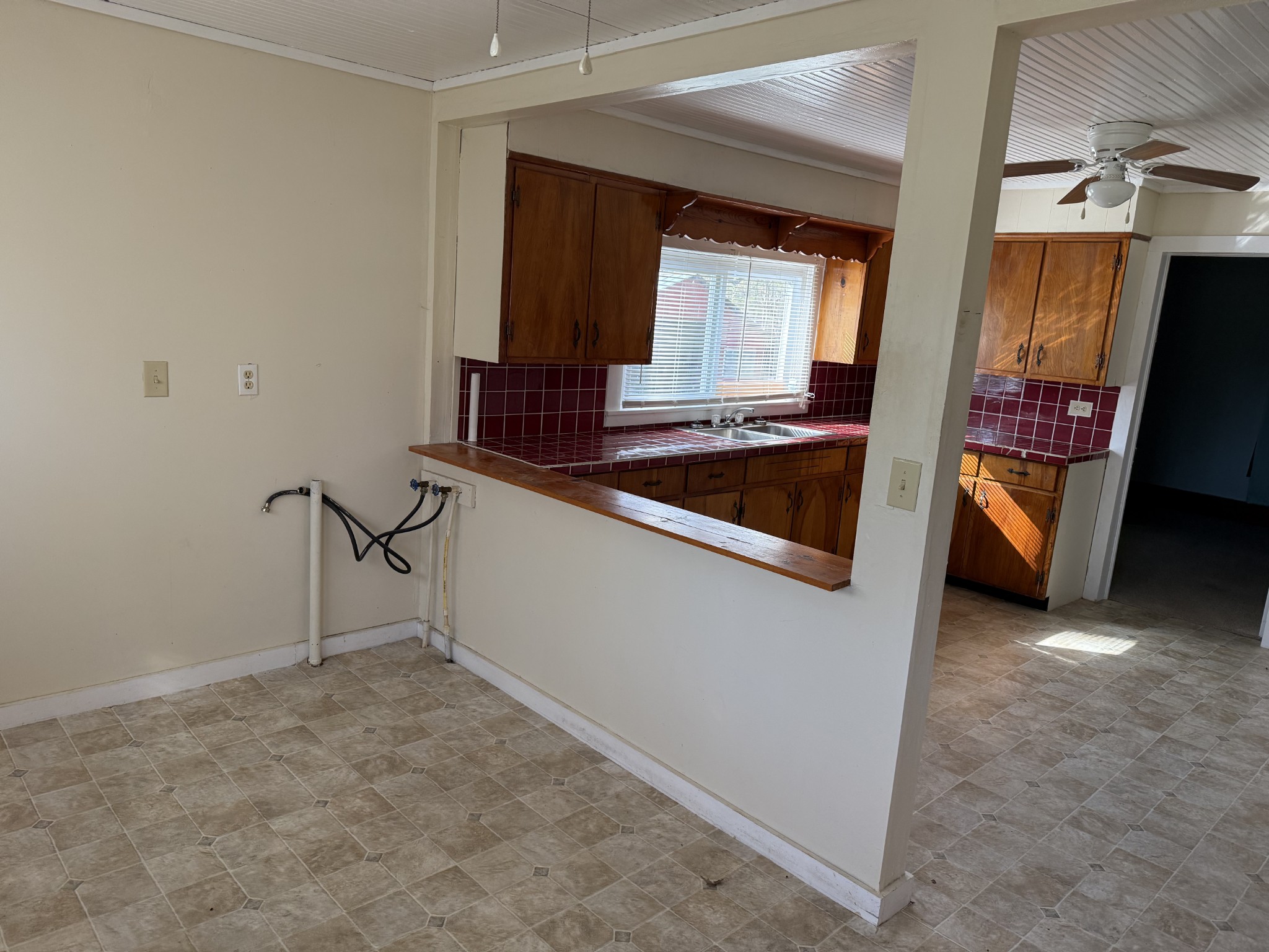 21625 Seminary Street Hollow Rock, TN 38342 - Photo 5 of 17 a kitchen with stainless steel appliances a refrigerator and stove