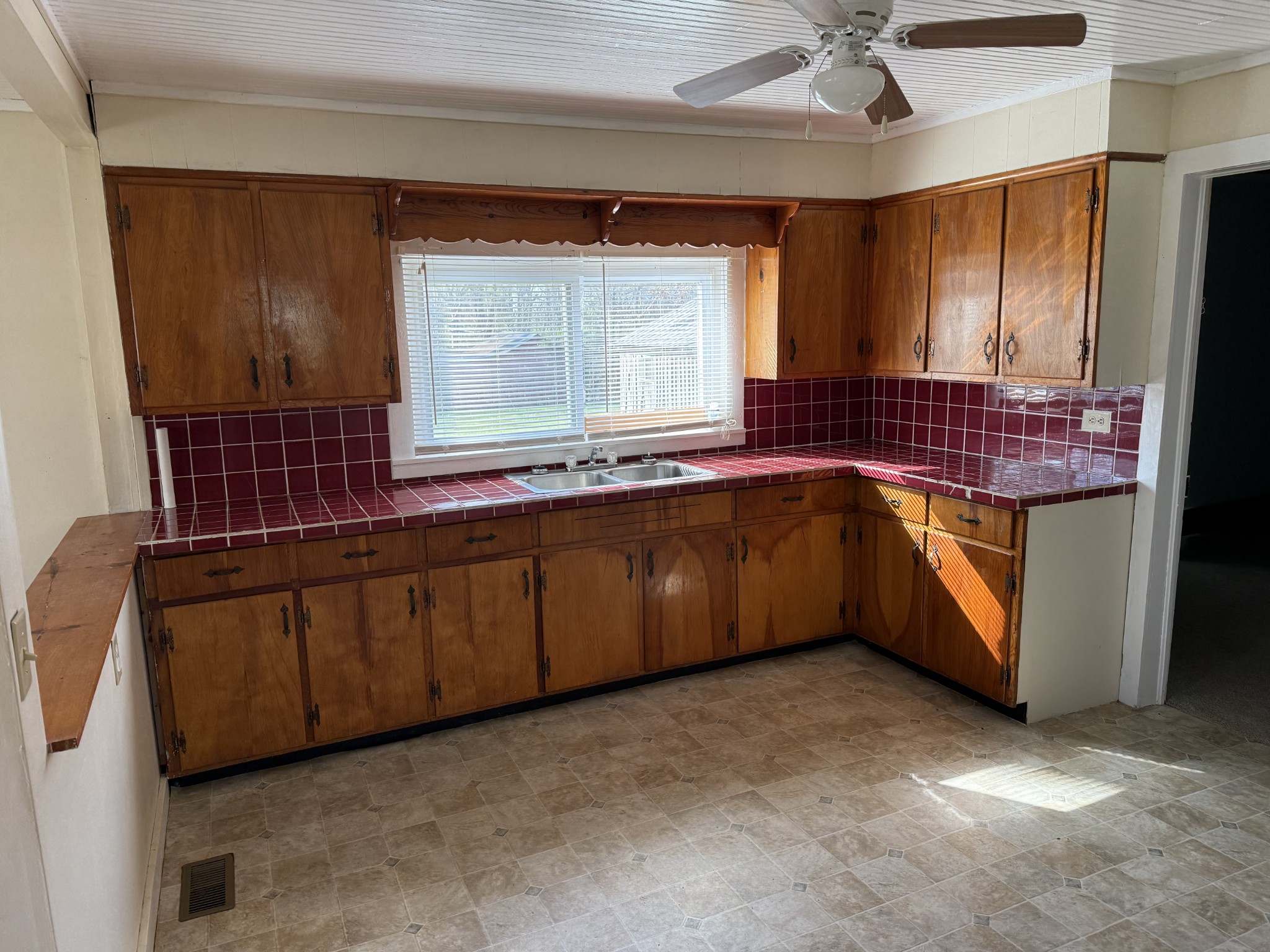 21625 Seminary Street Hollow Rock, TN 38342 - Photo 6 of 17 a kitchen with a sink and cabinets