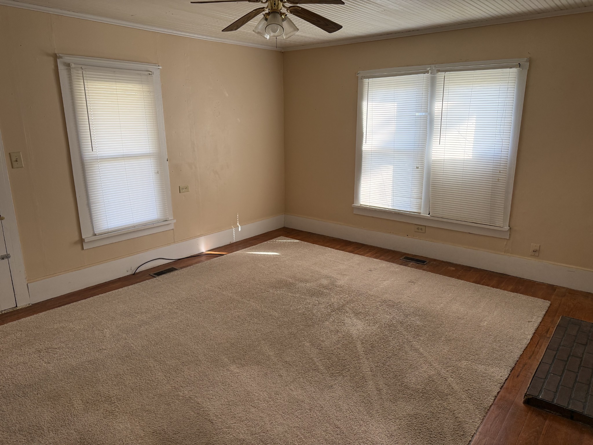 21625 Seminary Street Hollow Rock, TN 38342 - Photo 8 of 17 an empty room with windows and cabinet