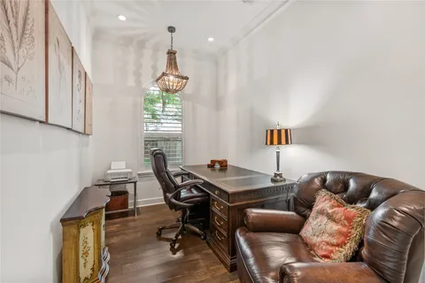 a livingroom with furniture and a chandelier