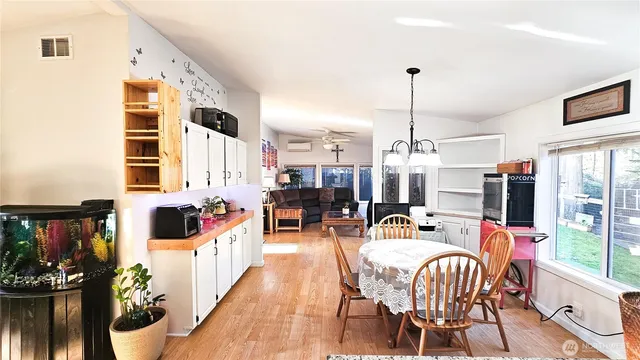 a outdoor living space with furniture and a flat screen tv