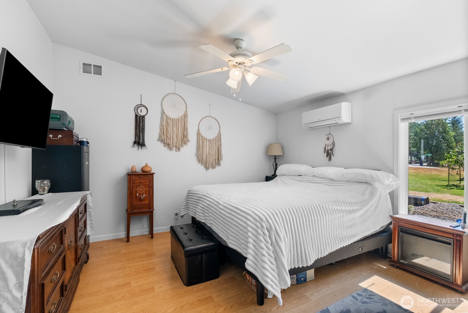 12933 Trout Farm Road Sultan, WA 98294 - Photo 14 of 38 a bedroom with a bed and a flat tv screen on dresser