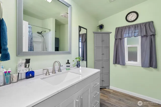 a bathroom with a sink and a mirror