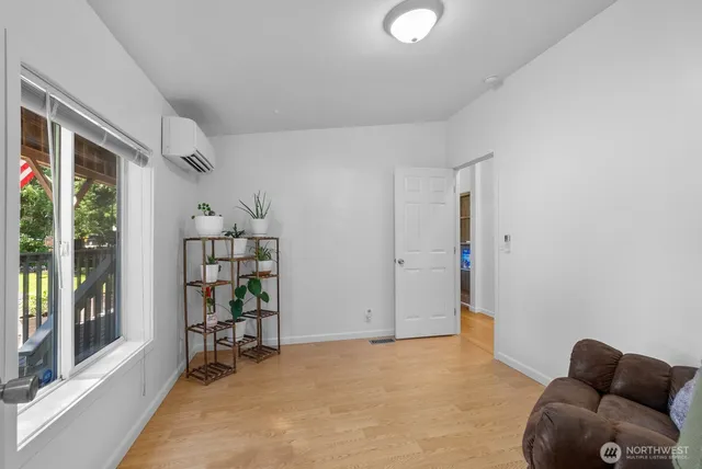 a view of livingroom with furniture and a bookshelf