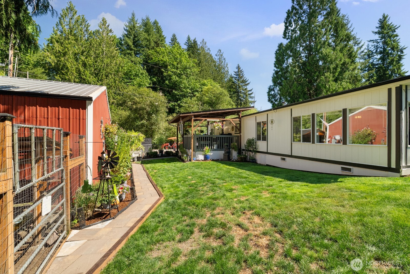 12933 Trout Farm Road Sultan, WA 98294 - Photo 28 of 38 a view of backyard with garden and deck